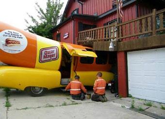 An Oscar Mayer Wienermobile crashed into the home and outdoor deck of Nick Krupp, 1200 Kenilworth Ave., around 11 a.m. Friday, July 17, 2009. According to a witness, the vehicle was parked in the driveway. The driver lurched the vehicle forward instead of backing out of the driveway, hitting Krupp's deck and cracking the foundation of his house.